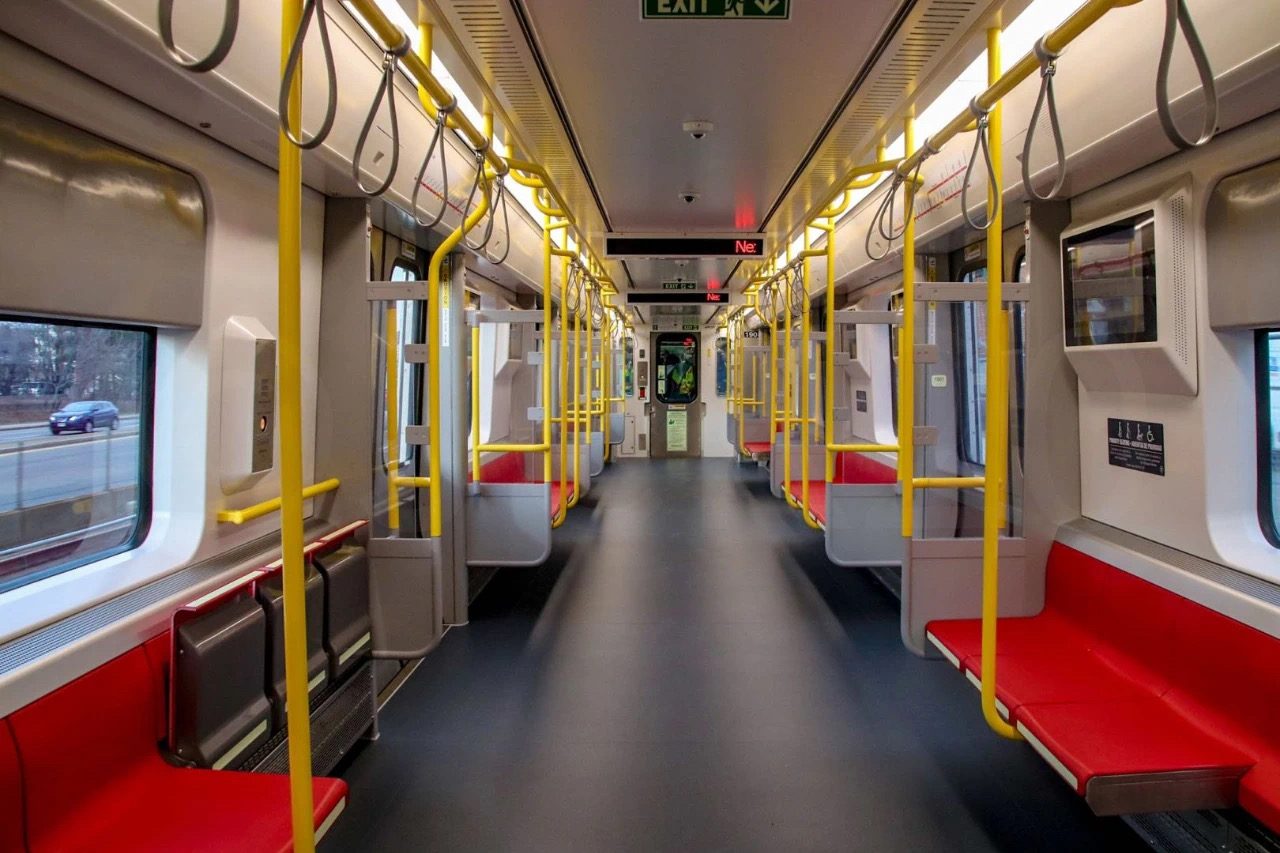 Seating, handrails and windscreens installed in a new MBTA Red Line car